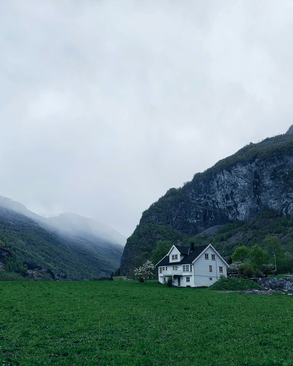 3-storey house beside mountain