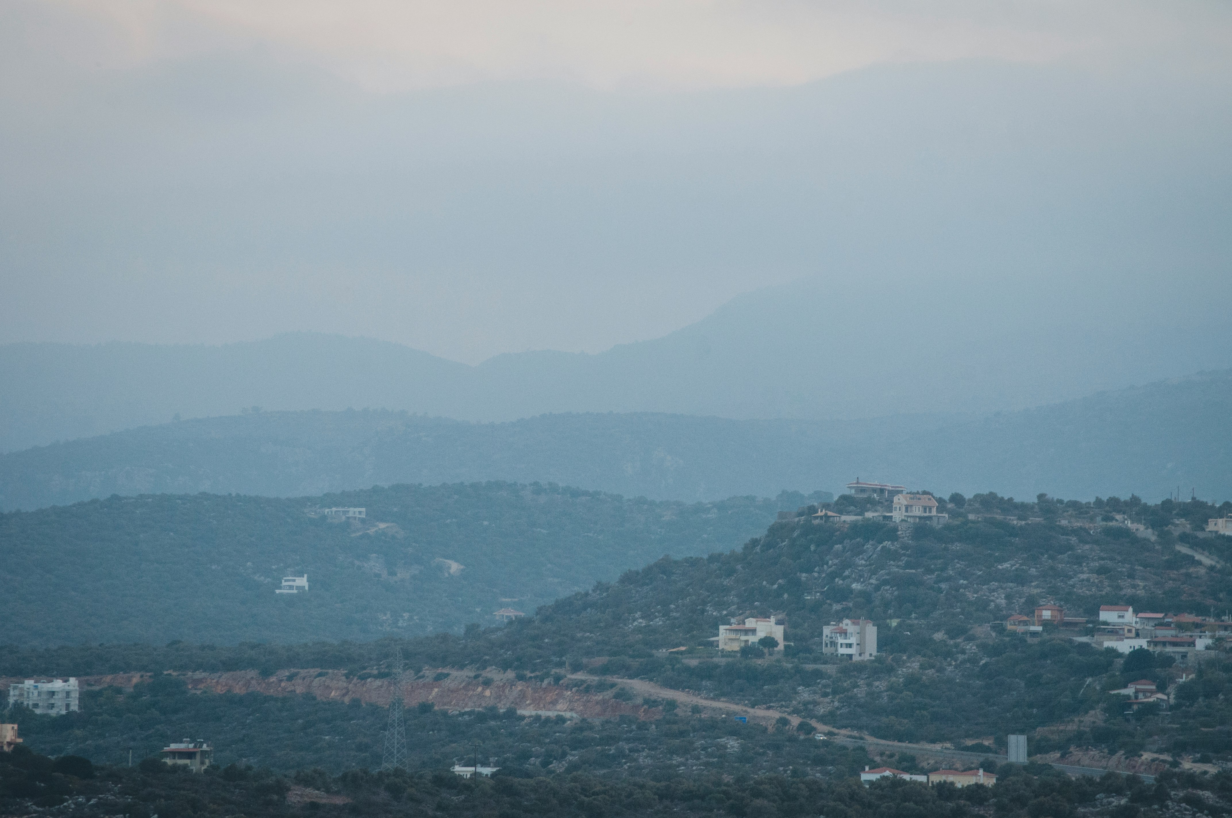 aerial photography of building near mountain during daytime