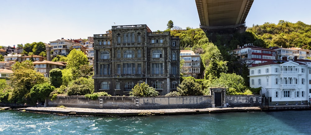 gray concrete building near bridge