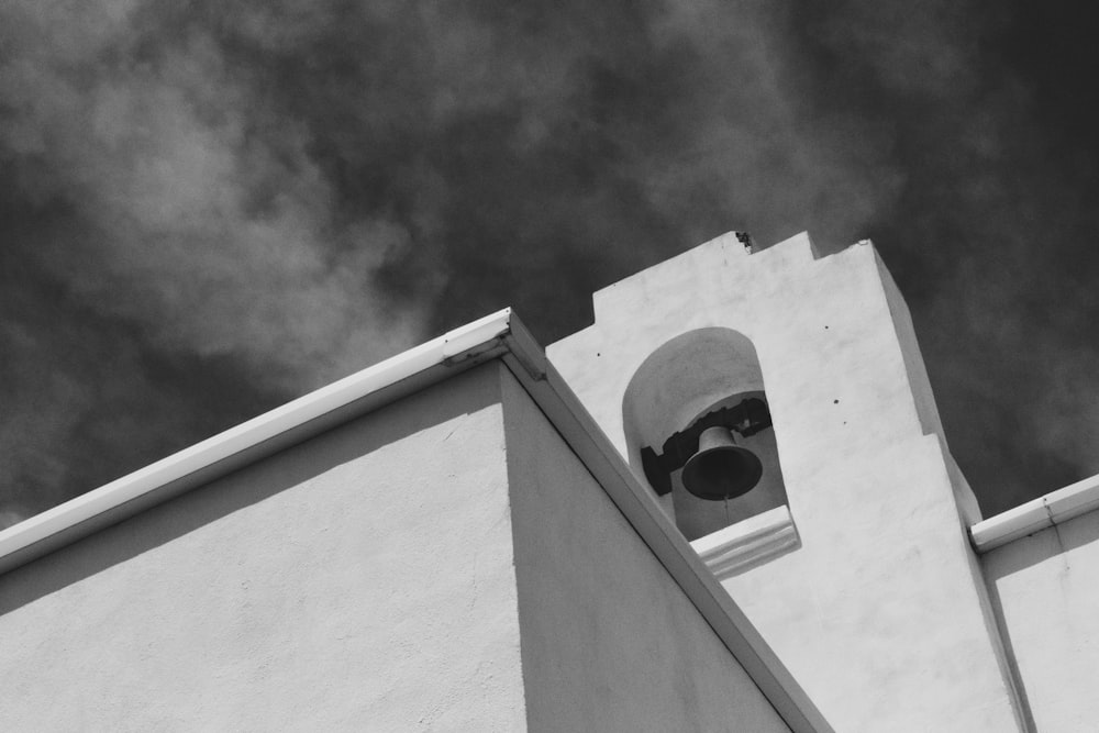 greyscale photo of church bells
