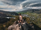 man standing on boulders