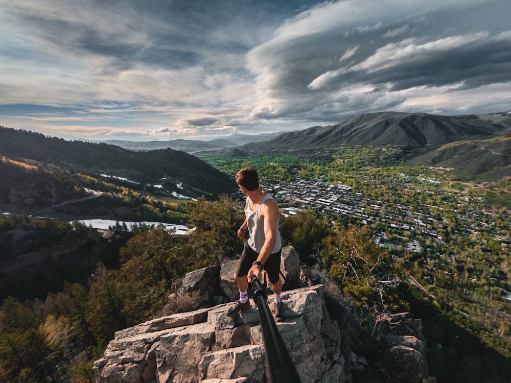 man standing on boulders