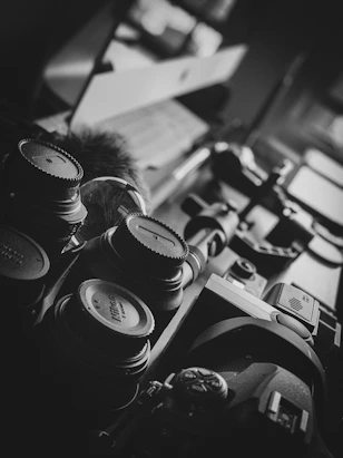 Close-up of high-quality camera gear displayed neatly on a table.