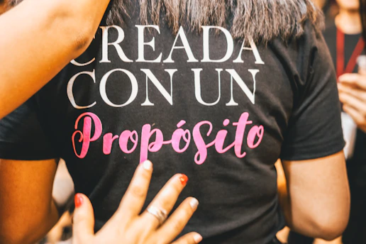 woman wearing black, white, and pink shirt