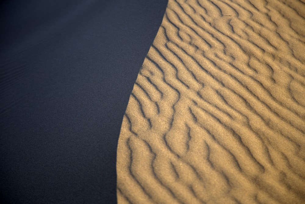 a sand dune in the middle of a desert