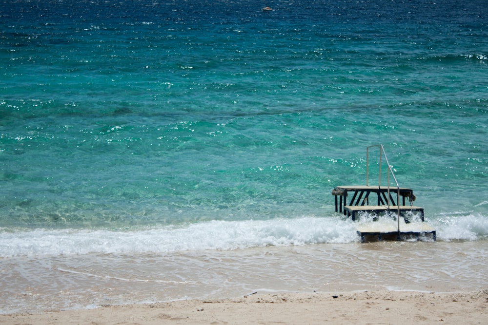 stairs with handrail on shore during day