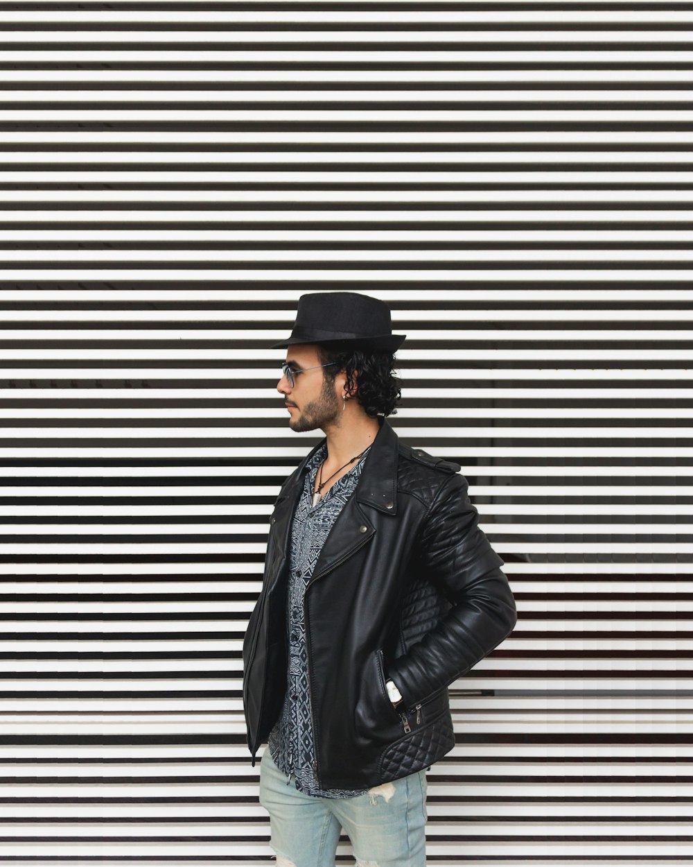 man wearing black leather jacket