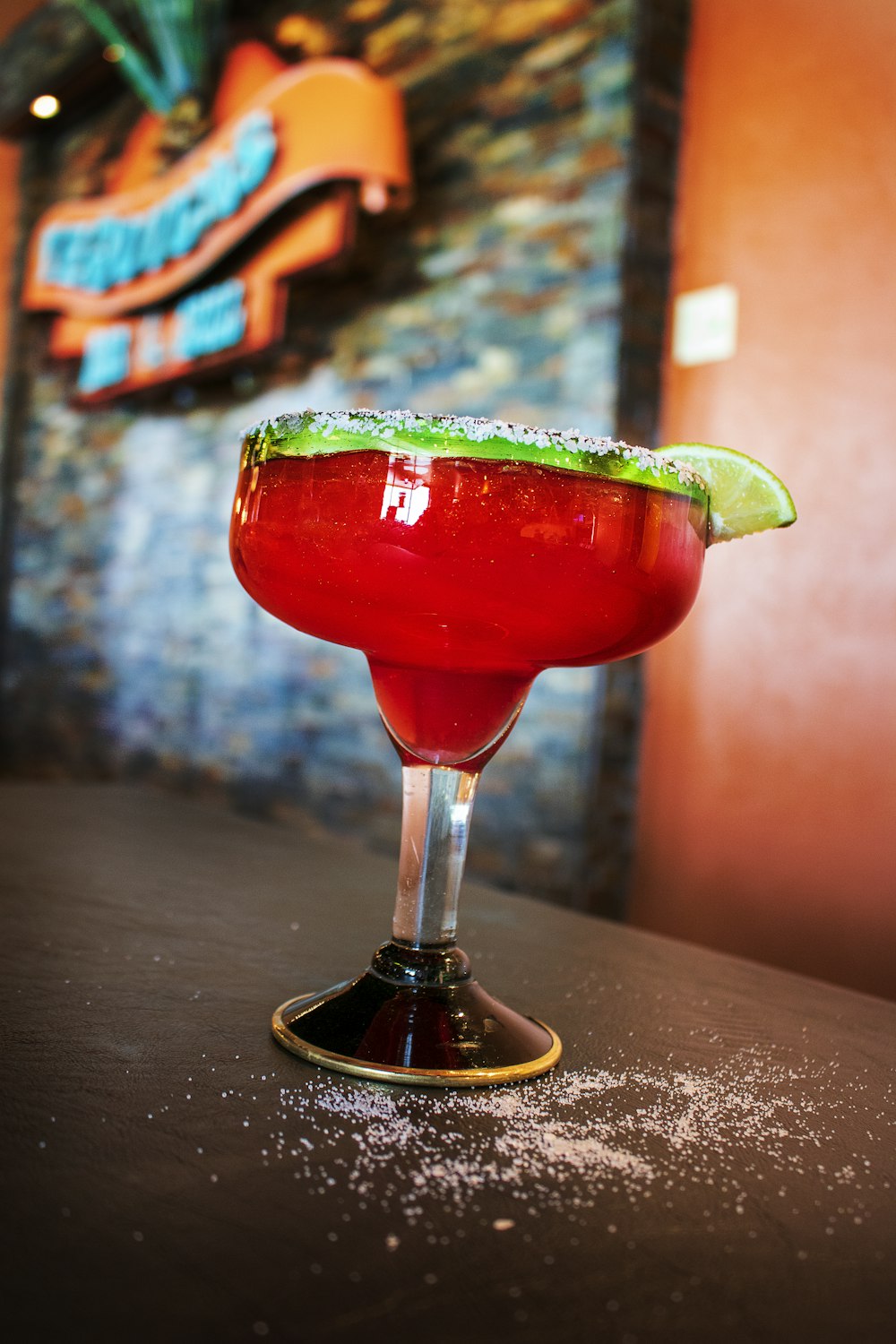 martini glass filled with red beverage