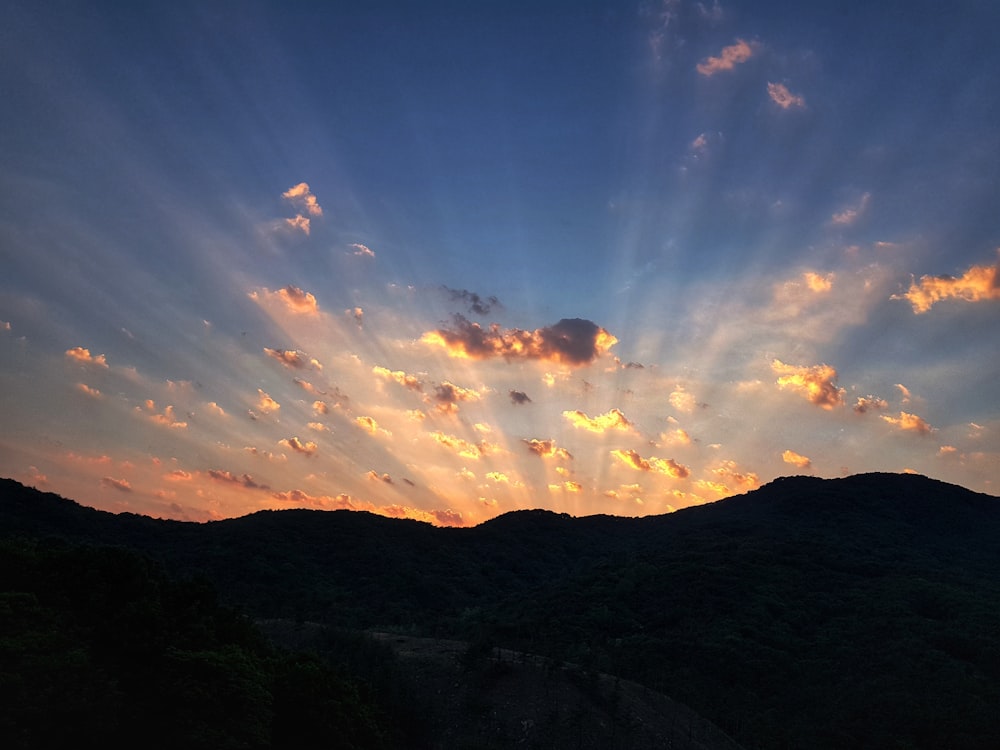 silhouette of mountain during golden hour