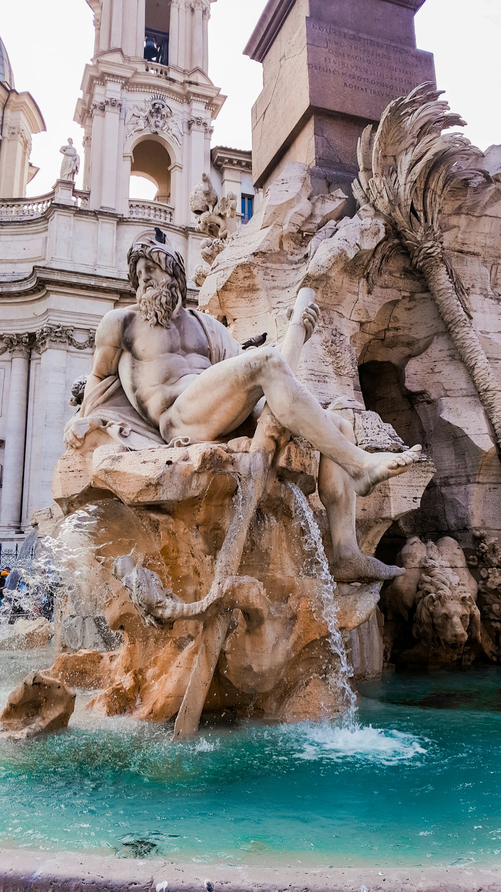 man with beard water fountain statue during daytime