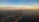 Aerial shot of a serene coastline at sunset, highlighting natural beauty.