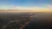 A serene aerial shot of a coastal Portuguese landscape at sunset, highlighting natural beauty and calm.