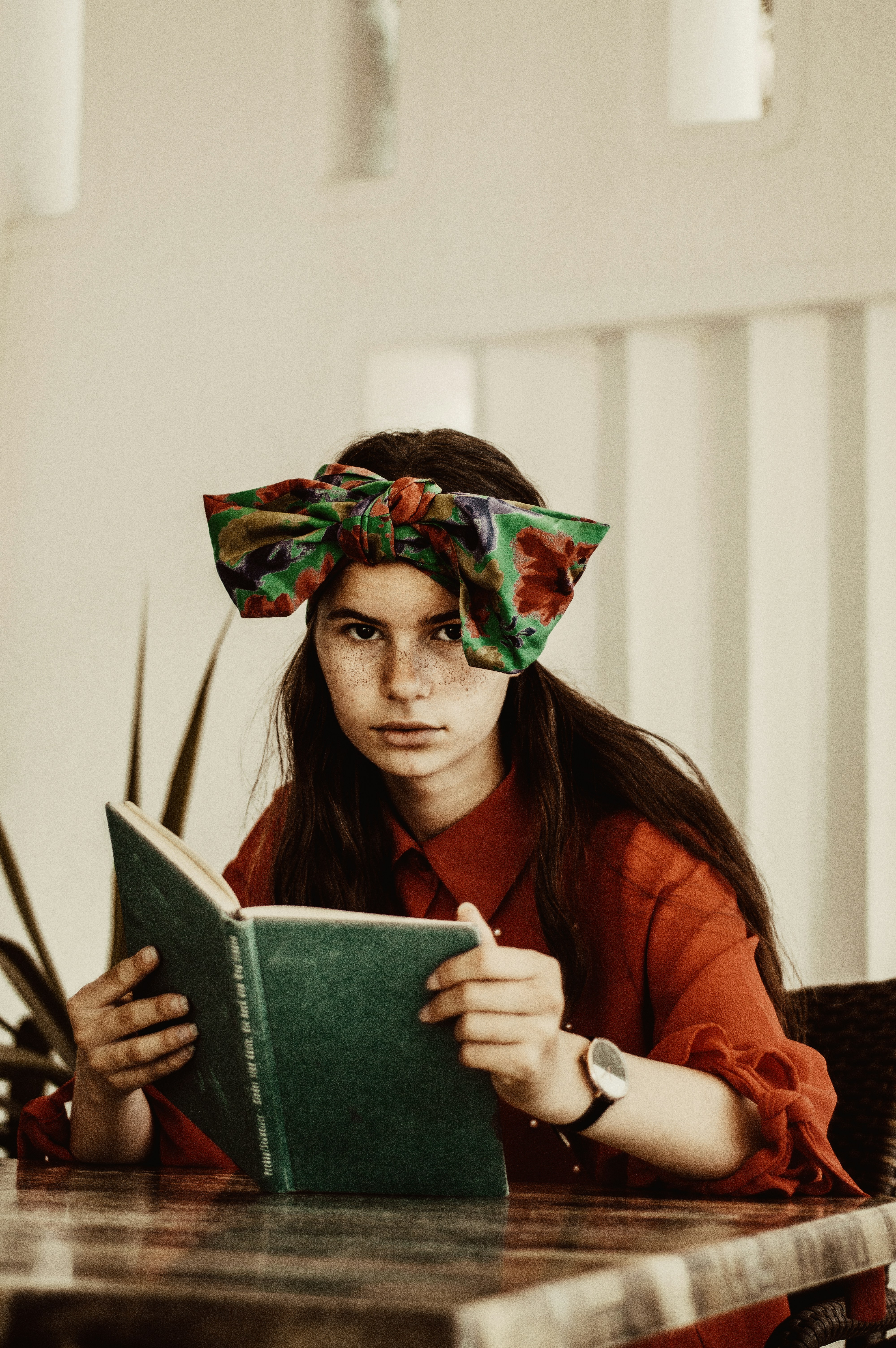 woman holding an open book