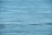 Calm and expansive body of water with gentle ripples across the surface, reflecting a serene blue hue.