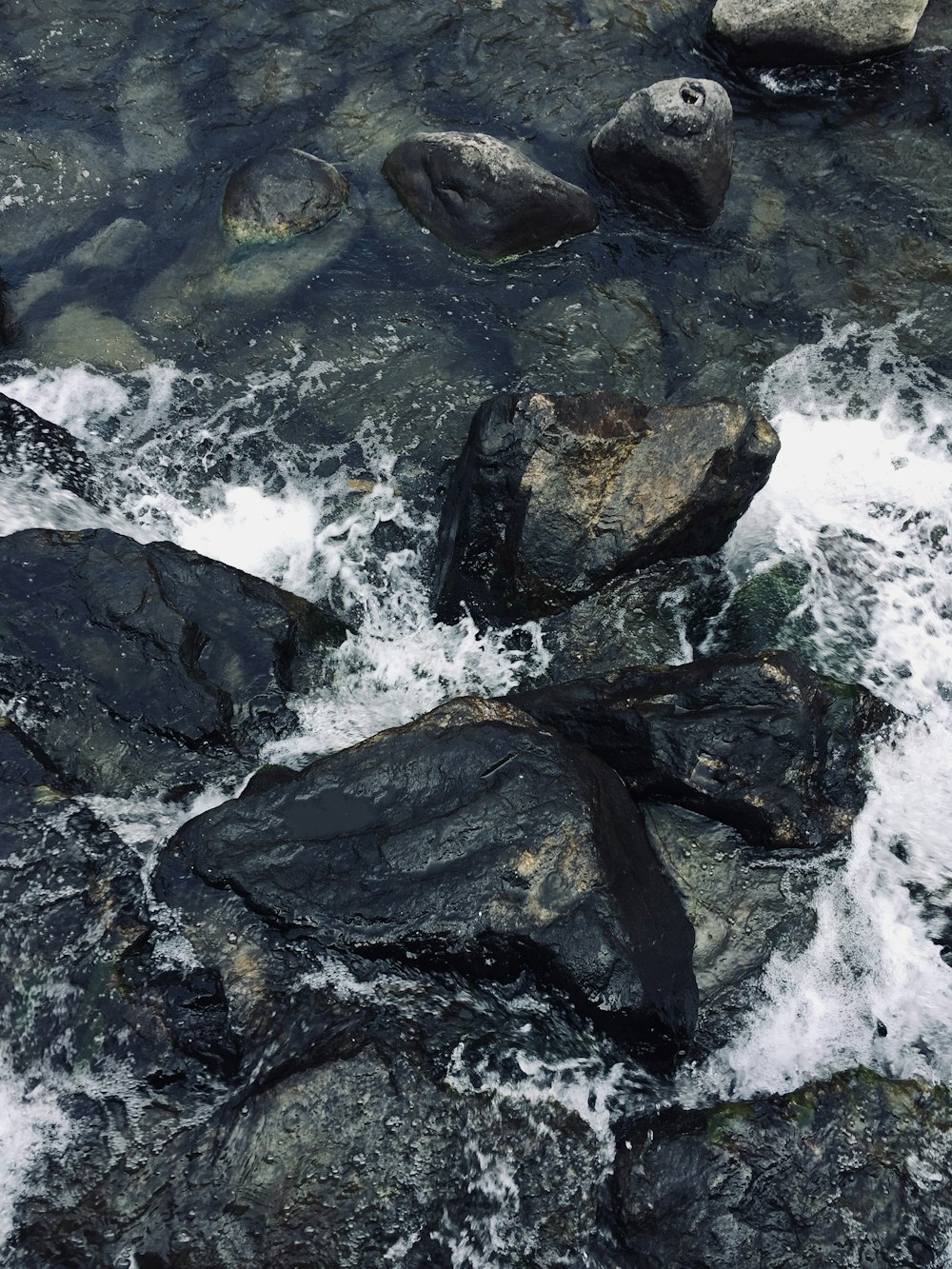 water crashing on boulders