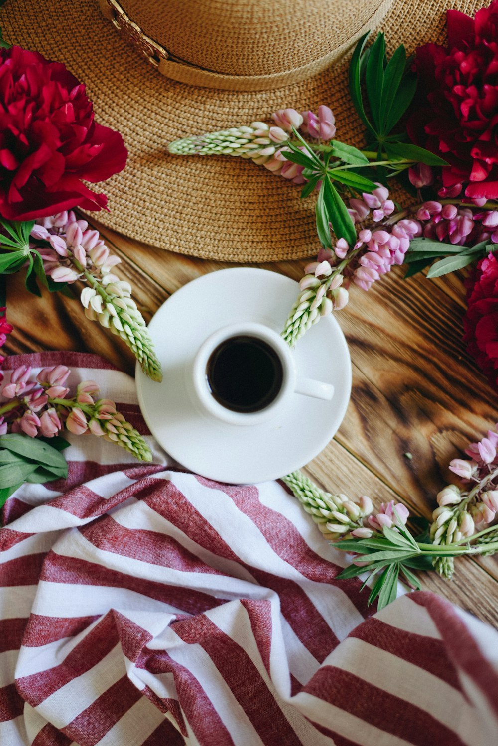 flat lay photography of coffee cup on saucer