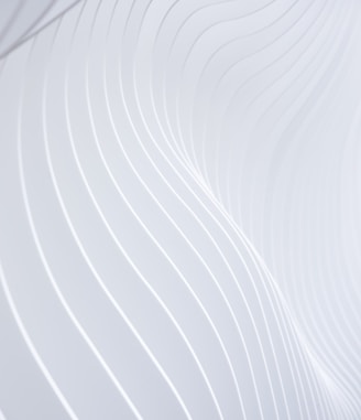 a close up of a white wall with wavy lines