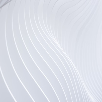 a close up of a white wall with wavy lines