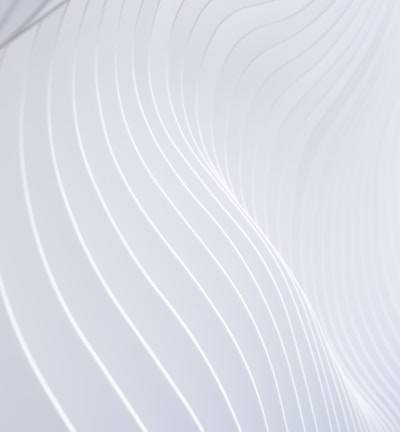 a close up of a white wall with wavy lines