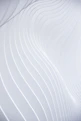 a close up of a white wall with wavy lines