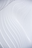 a close up of a white wall with wavy lines