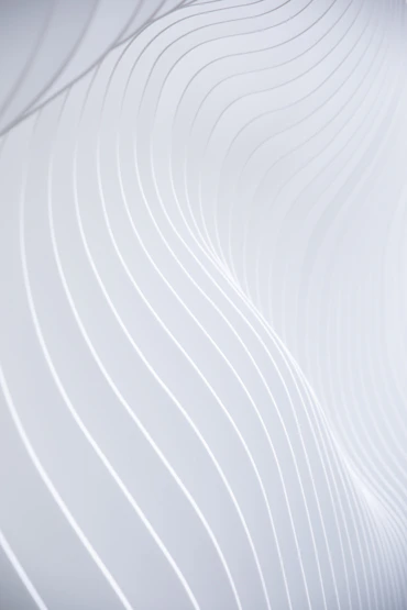 a close up of a white wall with wavy lines