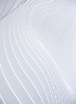 a close up of a white wall with wavy lines