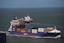 two cargo ships sailing during daytime