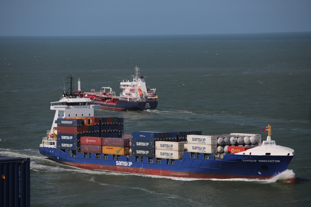 two cargo ships sailing during daytime