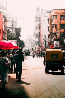 A vibrant Indian city street with colorful vehicles and people, reflecting the dynamic motor insurance market.