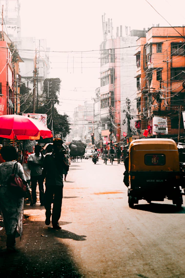 A vibrant street scene capturing daily life in a bustling South Asian city.