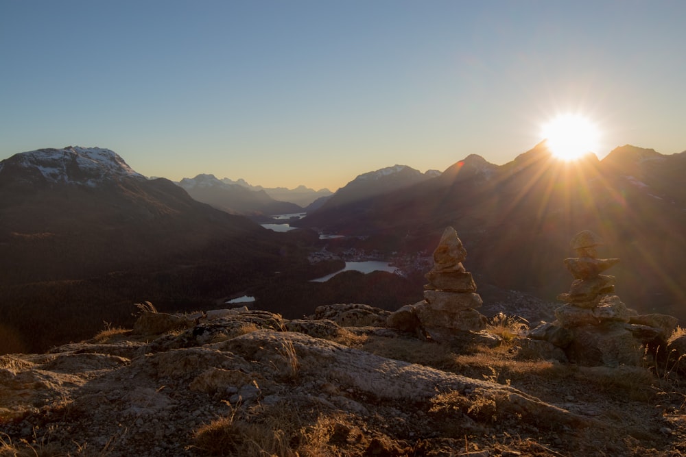 rock formation near mountain during sunrise