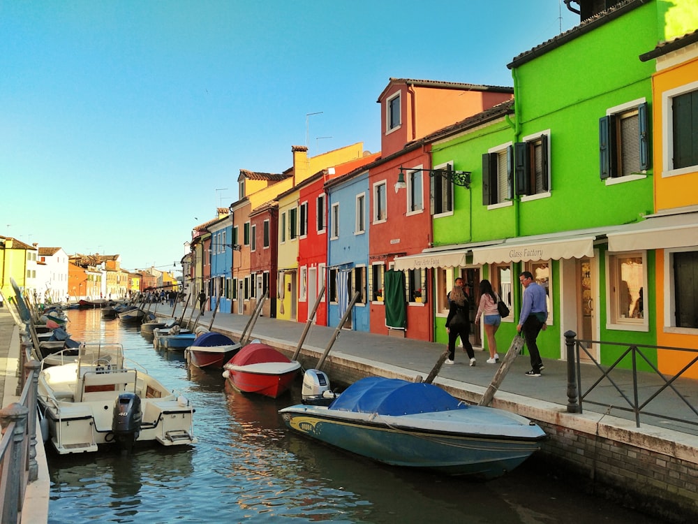 motorboats parked beside multicolored houses