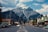 cars parked beside road near mountain
