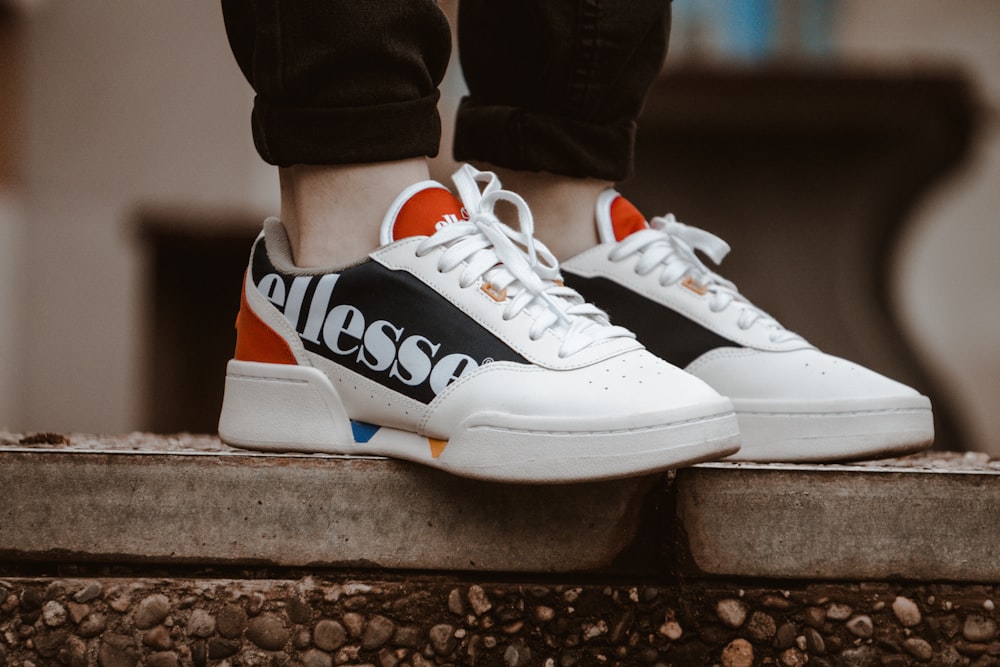 Pair of white-and-black Ellesse lace-up low-top sneakers photo – Free  Germany Image on Unsplash