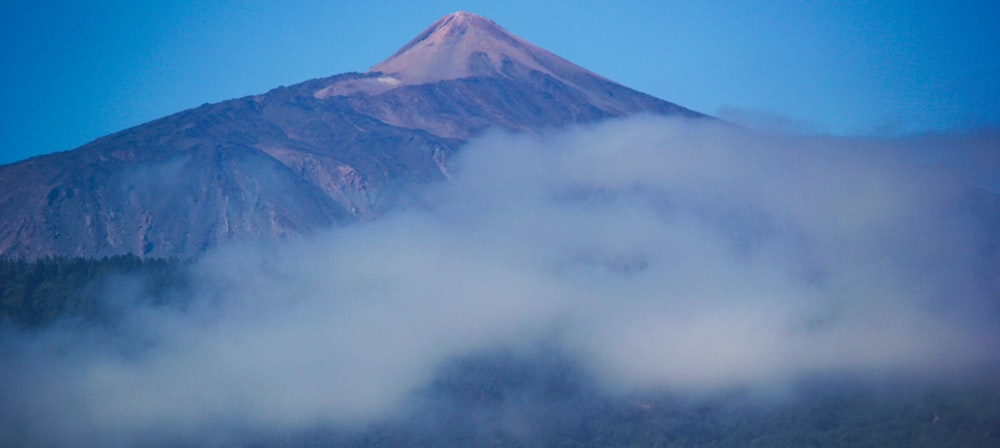 mountain and clouds during daytime