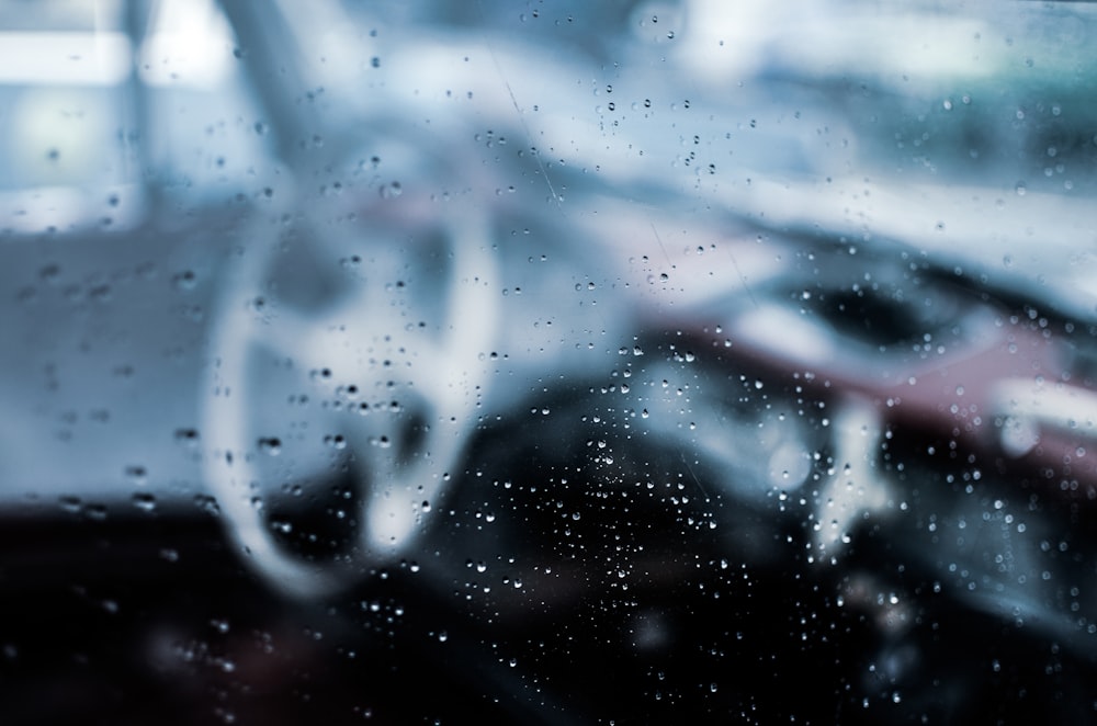 a close up of a window with rain drops