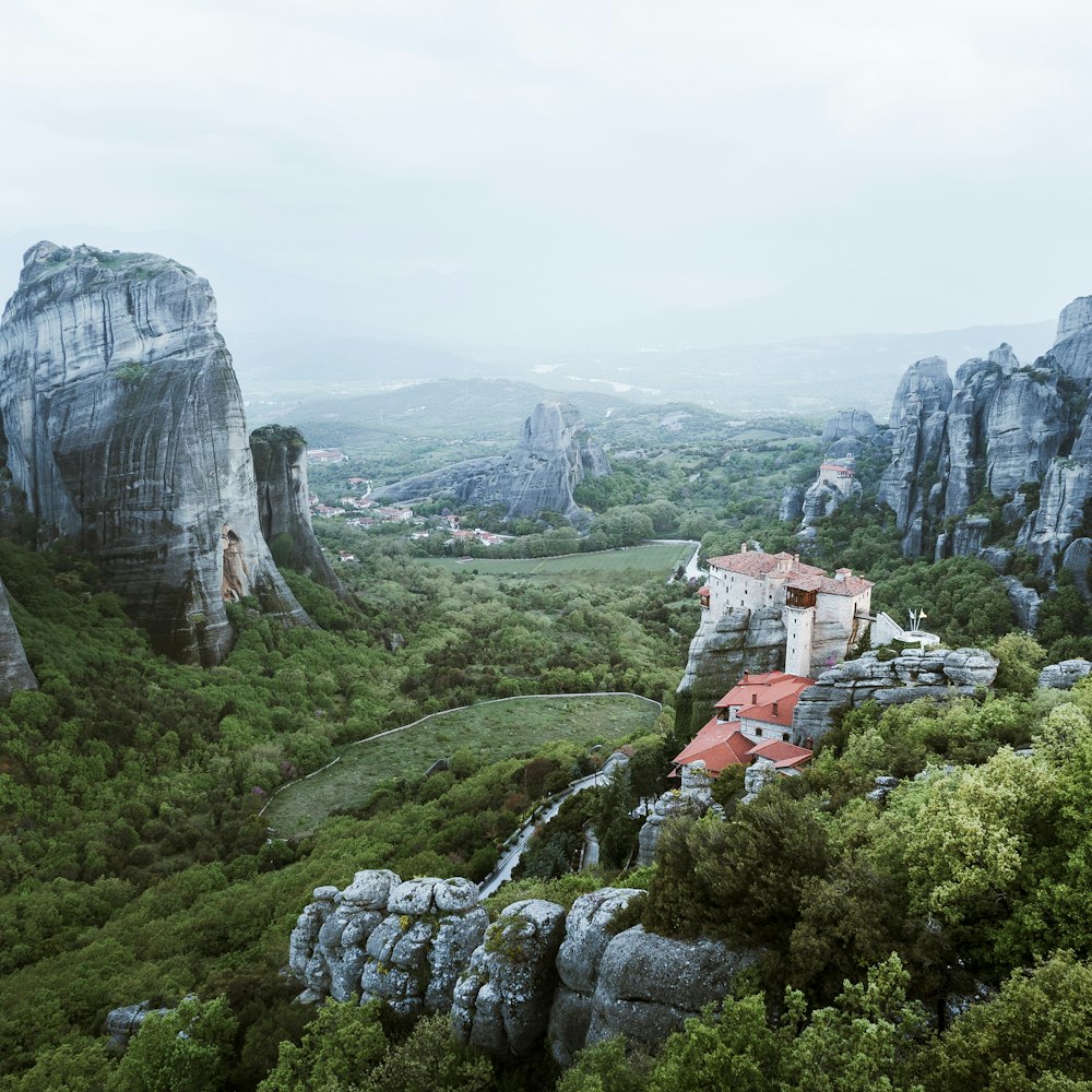 houses near mountain under foggy season