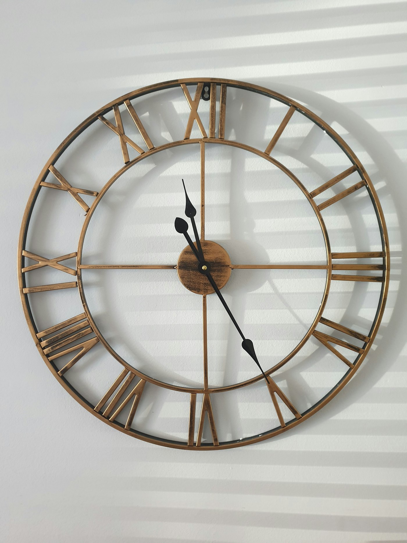Round brass wall clock