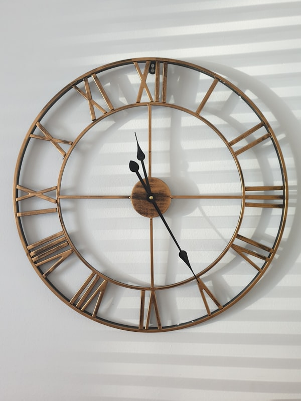 Round brass wall clock