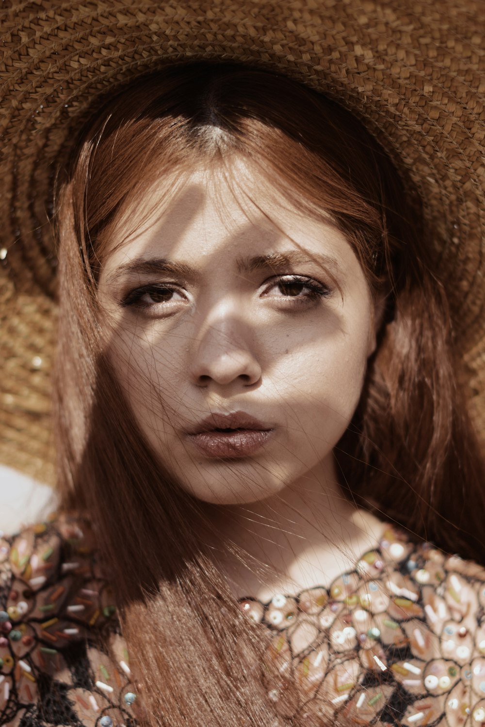 woman wearing straw hat