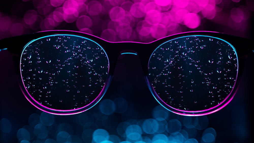 Black framed sunglasses with pink and white polka dot background photo – Free  Street photography Image on Unsplash
