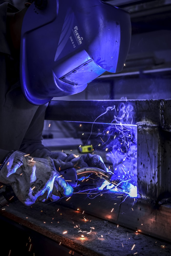 Welder welding a steel frame