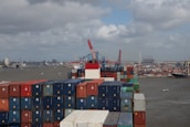 Global shipping containers at a busy port.