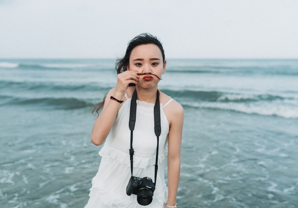 unknown person standing near body of water