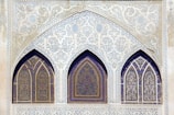 Islamic-style glass storefront with intricate patterns.