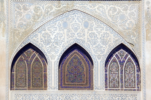 Islamic-style glass storefront with intricate patterns.