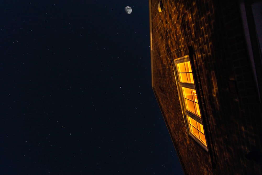 building with lights on on night time