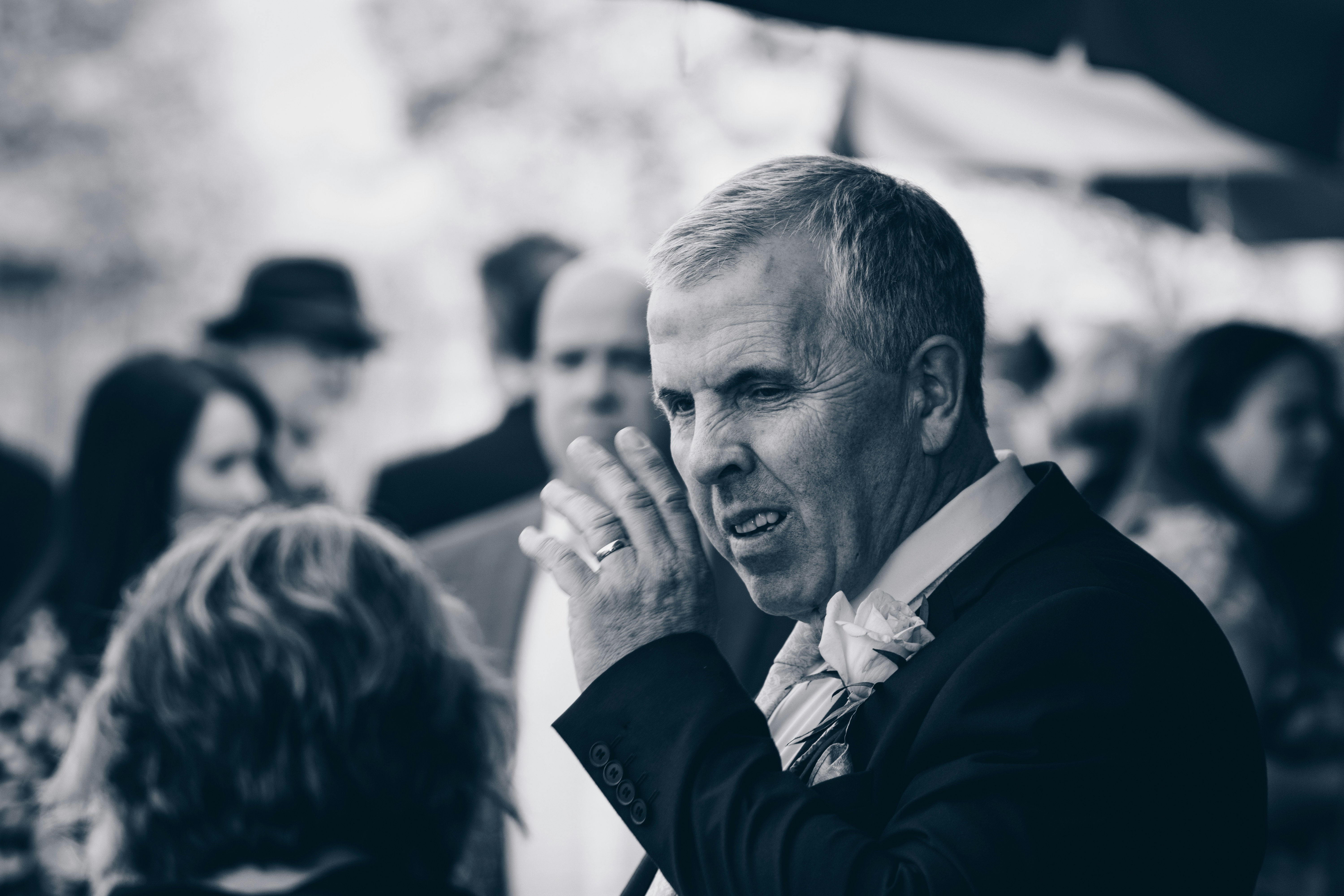 grayscale photography of man wearing blazer