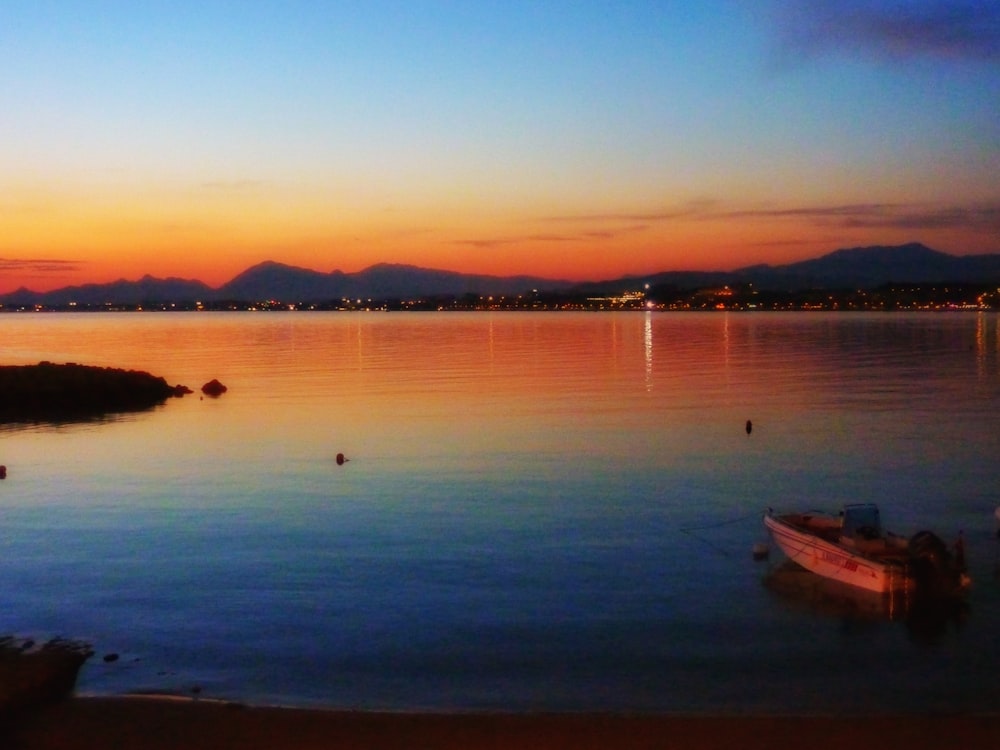 dinghy boat at calm body of water